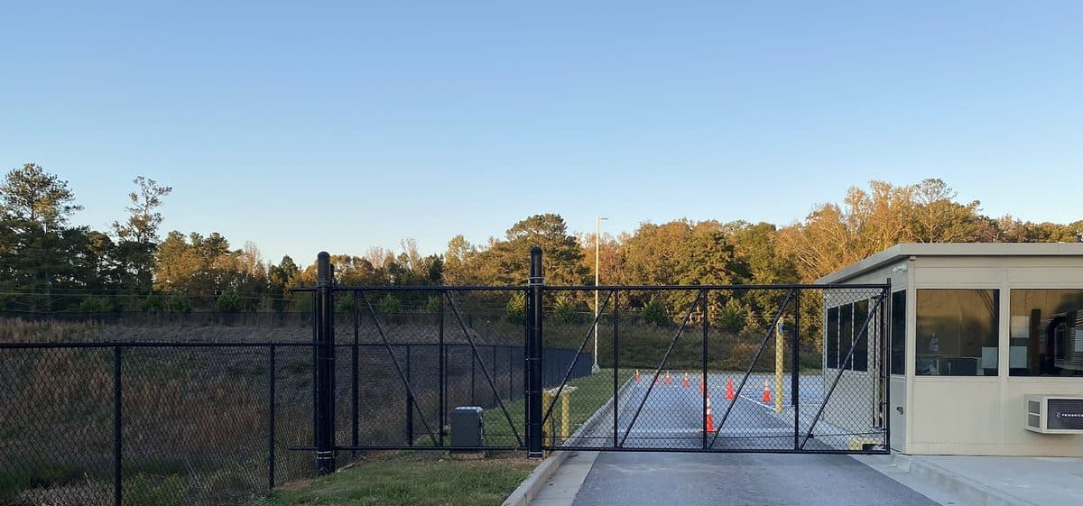 Black chain link security fence and gate at commercial property in Georgia