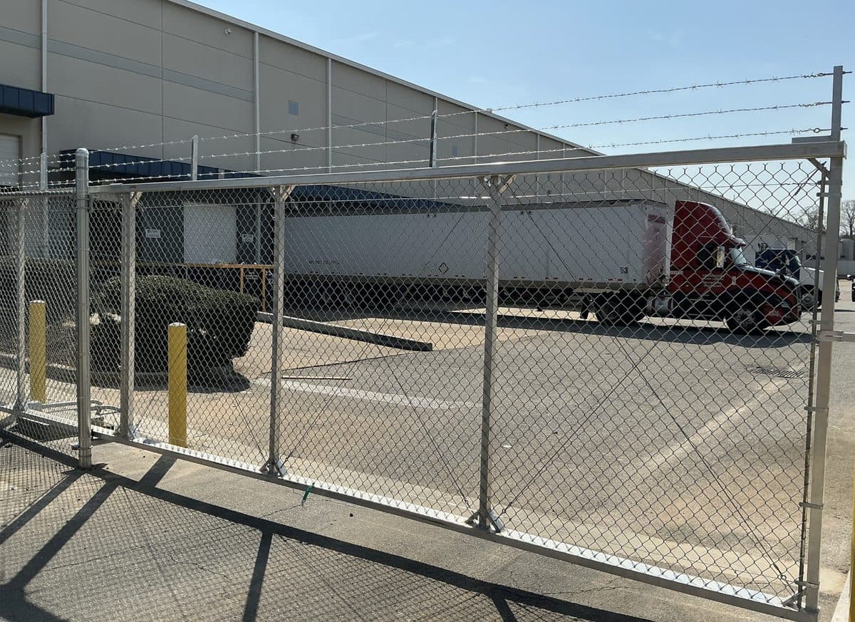 Chain link cantilever slide gate at warehouse in Georgia