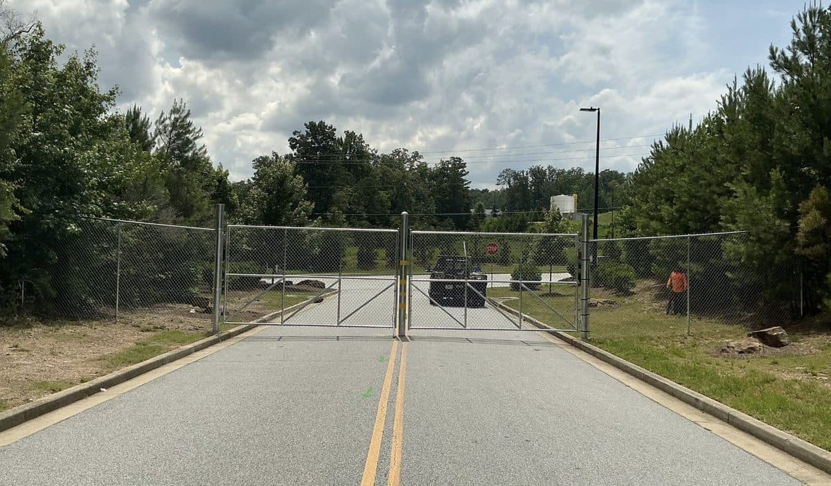 Commercial chain link double swing gate at property entrance in Georgia