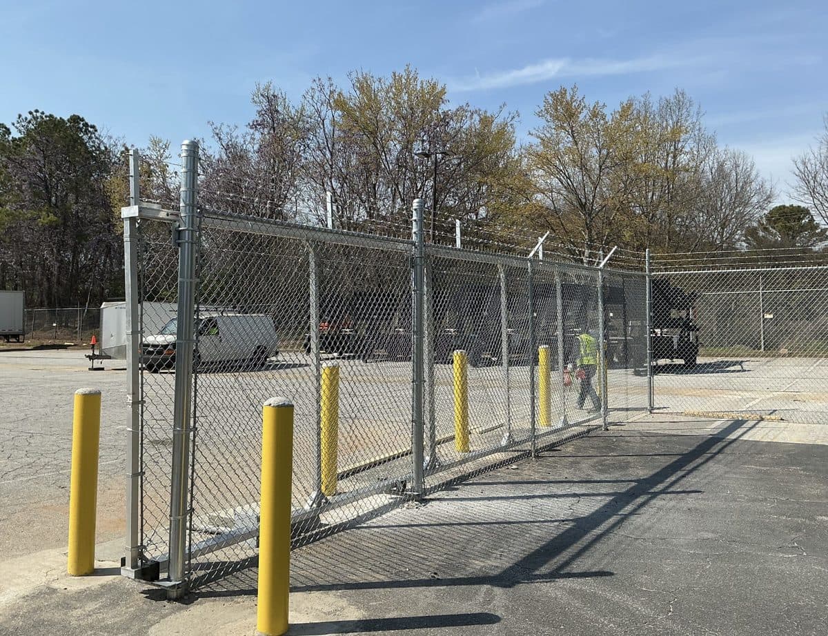 Commercial chain link security fence with bollards in Georgia