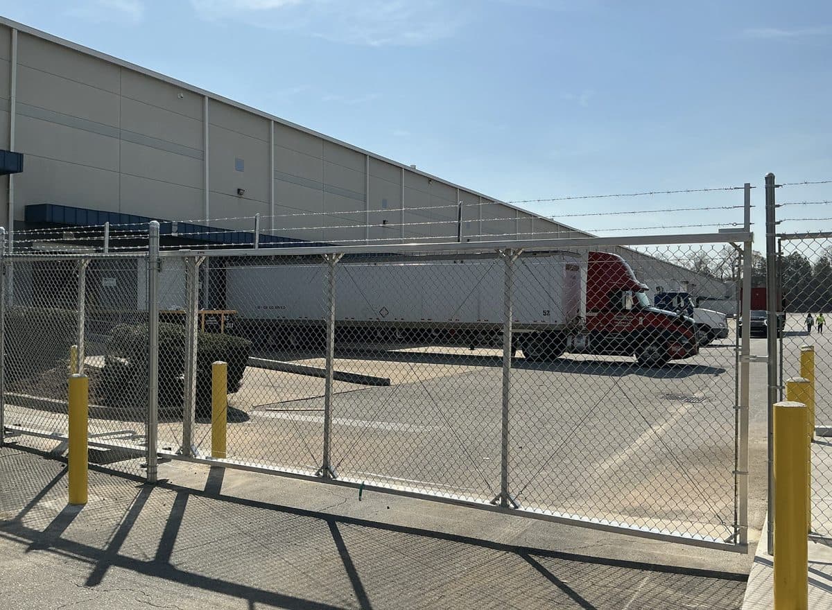 Commercial chain link slide gate at warehouse in Atlanta, GA