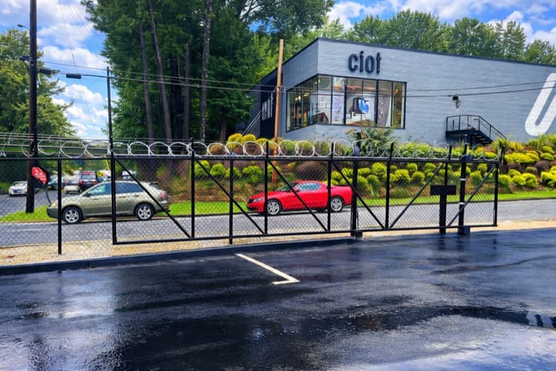 Commercial motorized slide gate installation by Fence Workshop in Georgia