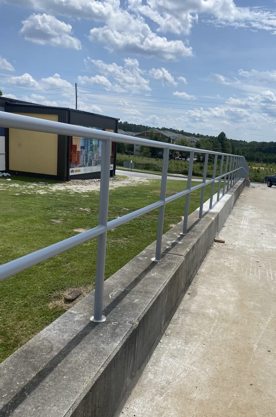 Commercial safety railing installation along concrete wall in Georgia