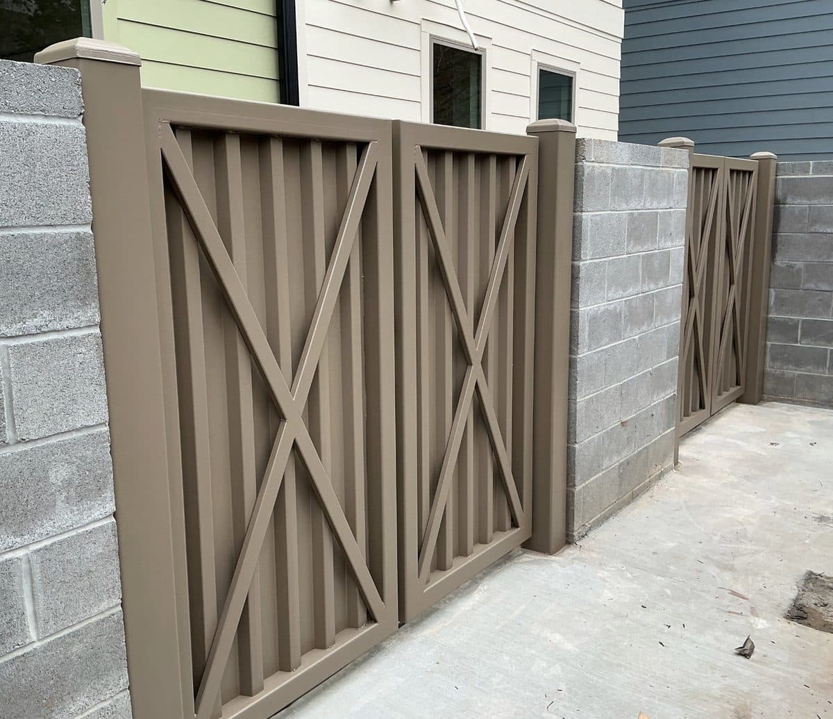 Custom dumpster enclosure gate installation in Atlanta, GA by Fence Workshop
