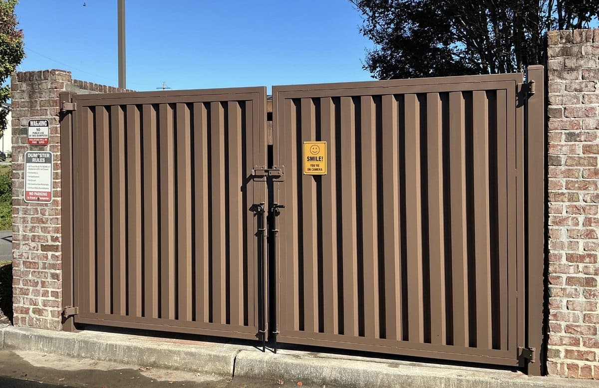 Steel panel dumpster gate in brick column enclosure, Atlanta, GA