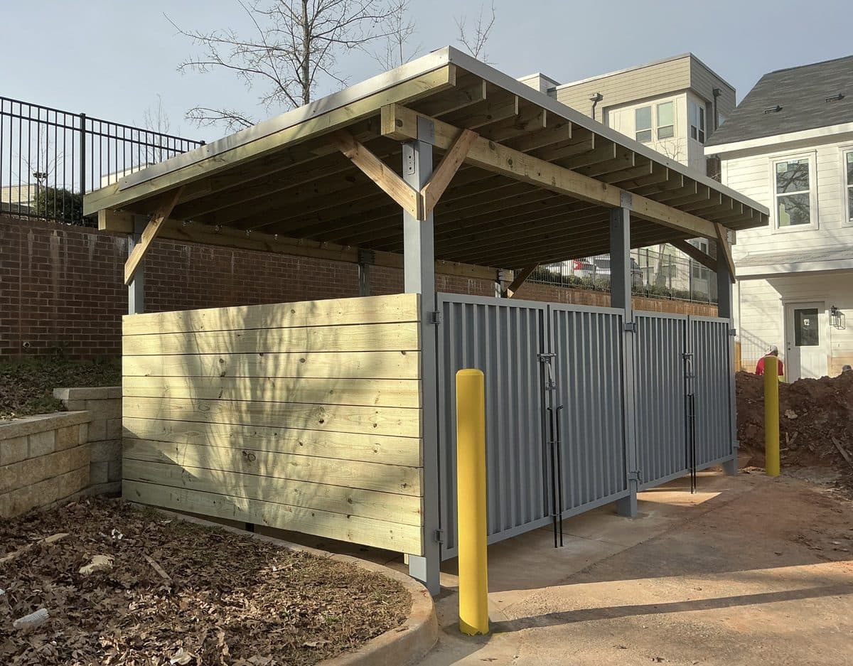 Custom garbage enclosure with roof installation in Atlanta, GA