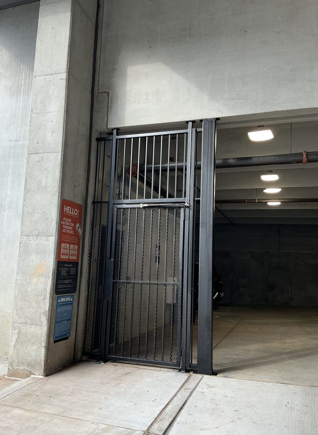 Parking deck mesh walk gate at ramp entry in Georgia