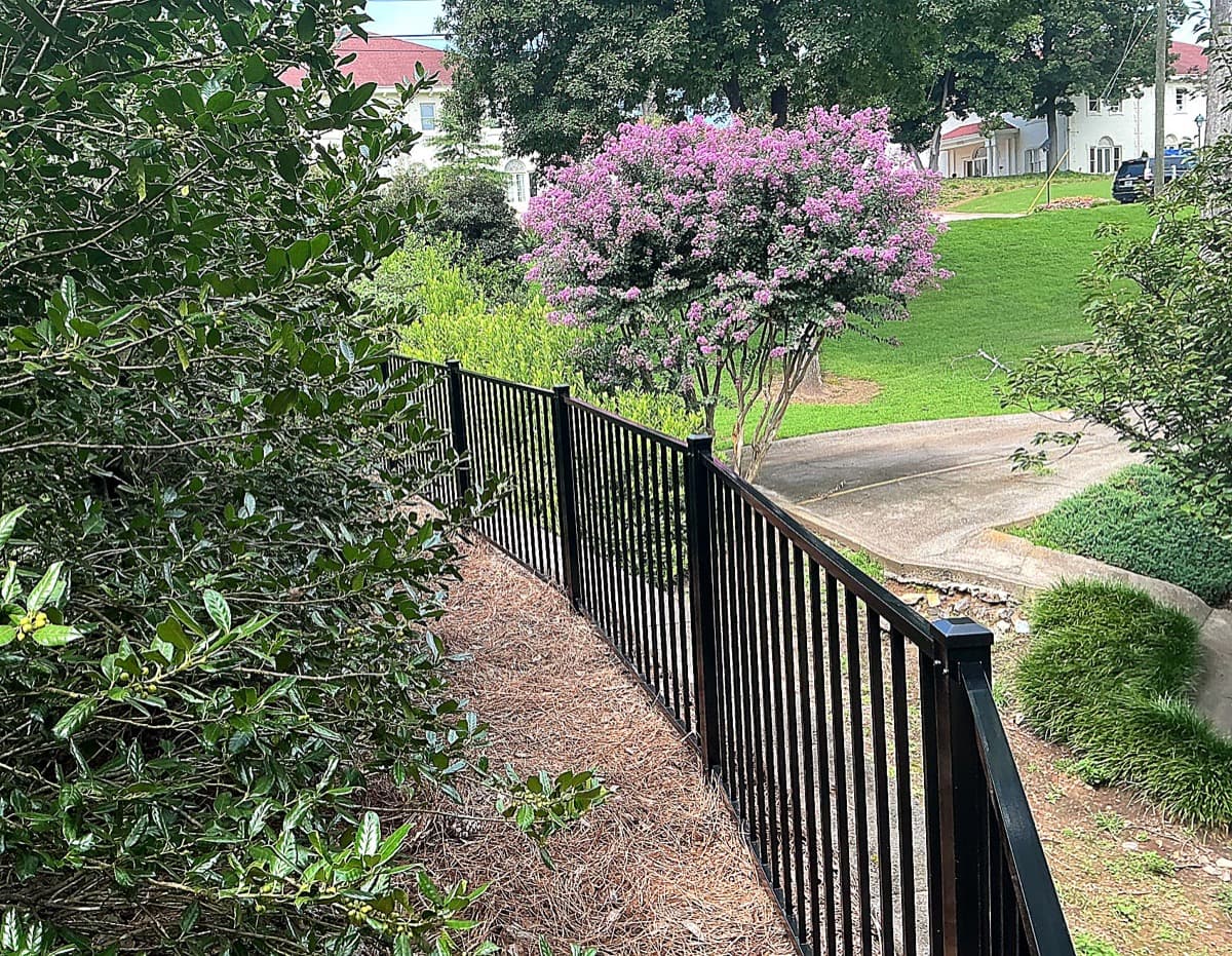 Smooth-top 2-rail black aluminum fencing installed in Atlanta, GA