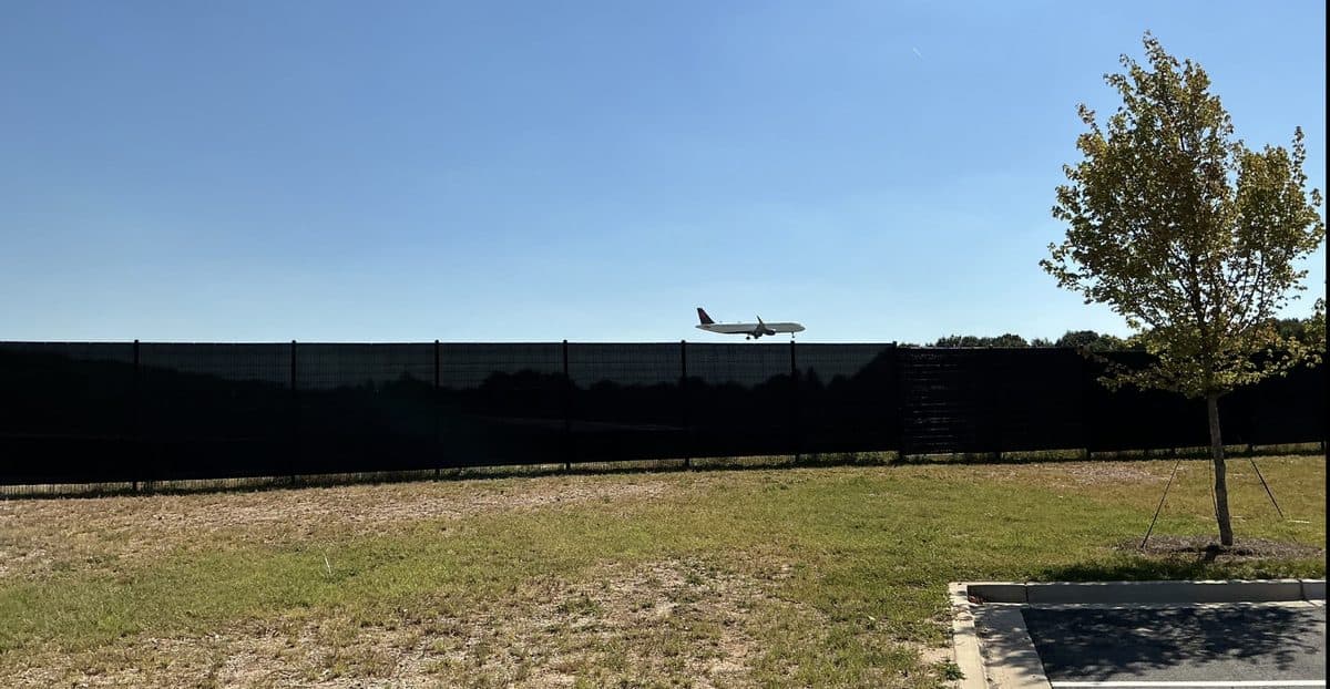 Tall perimeter security fence near airport in Georgia