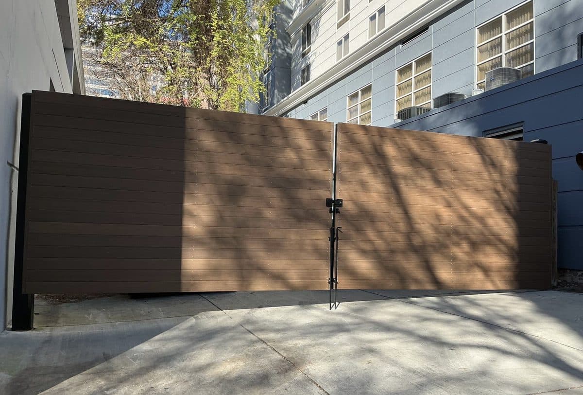 Wide wood composite dumpster gate installation, Atlanta, GA
