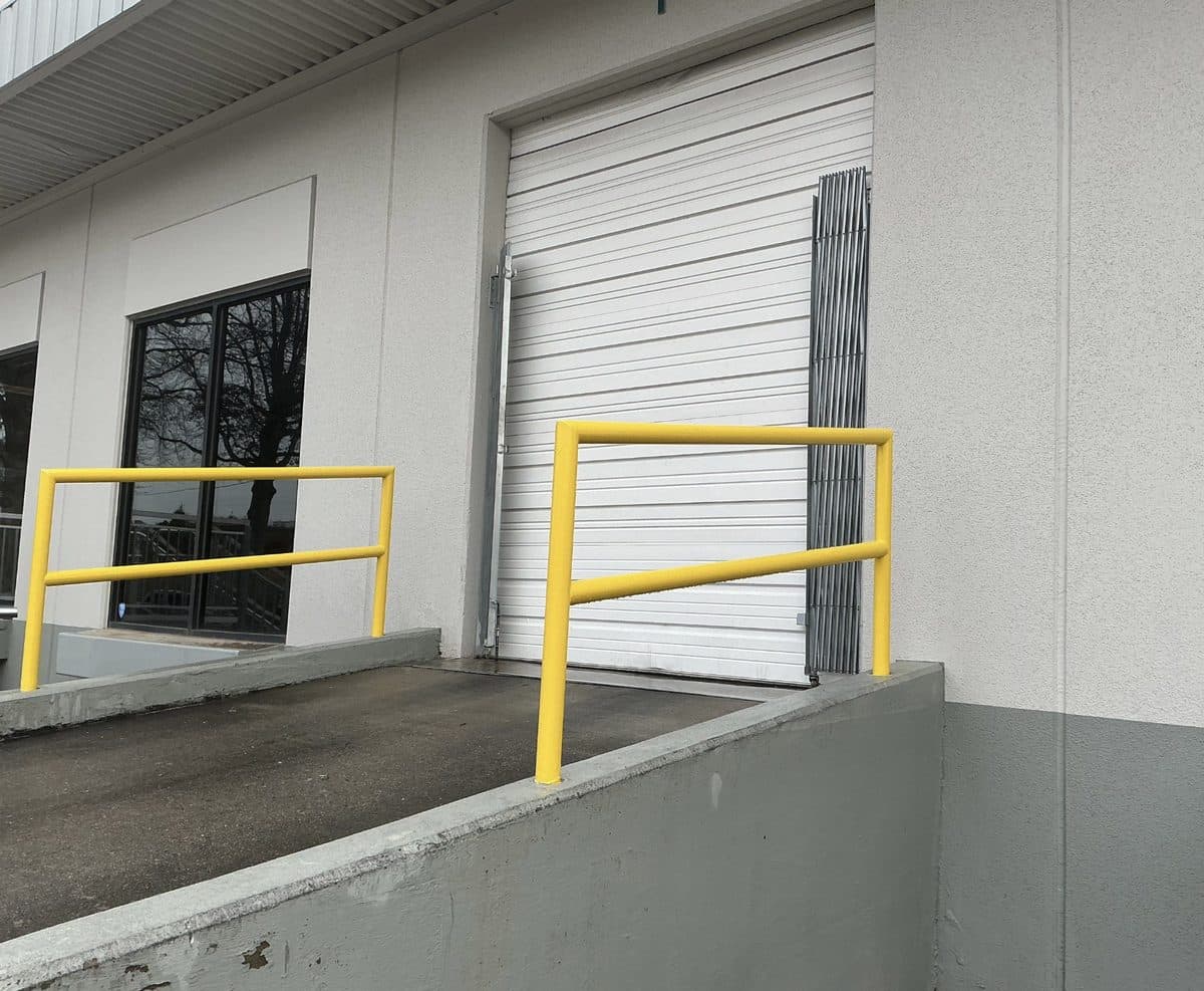 Yellow safety railing at commercial loading dock in Georgia
