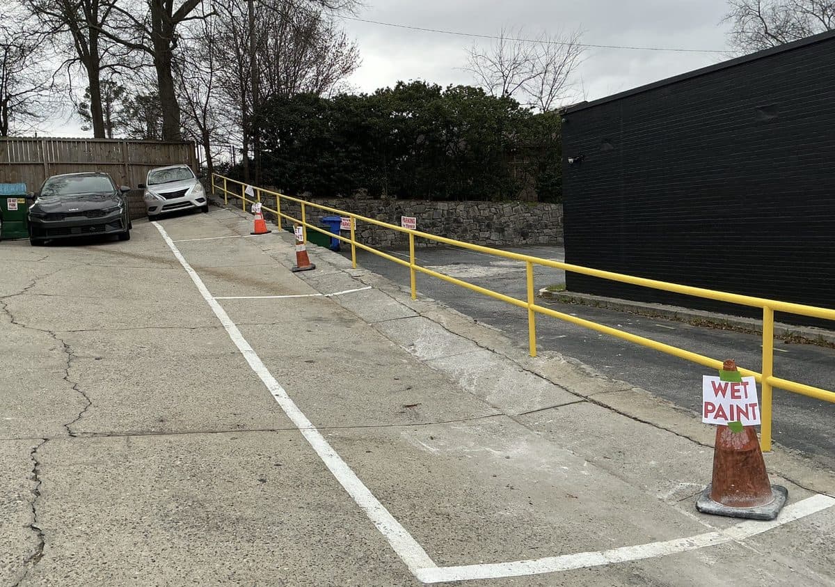 Yellow commercial safety railing installation in parking lot, Atlanta, GA